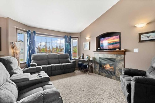 179 Issard Close, Red Deer, AB - Indoor Photo Showing Living Room With Fireplace