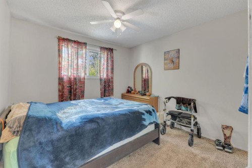 64 Sylvan Drive, Sylvan Lake, AB - Indoor Photo Showing Bedroom