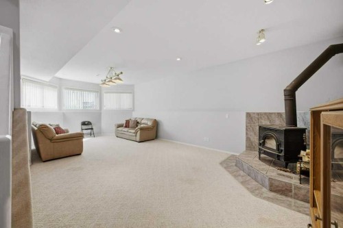 54 Lord Close, Red Deer, AB - Indoor With Fireplace