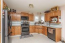 14 Lincoln Park, Lacombe, AB  - Indoor Photo Showing Kitchen With Double Sink 