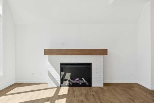 93 Bartlett Way Se, Calgary, AB - Indoor Photo Showing Living Room With Fireplace