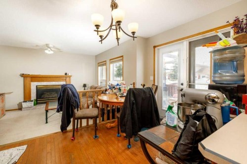 6 Densmore Crescent, Red Deer, AB - Indoor Photo Showing Dining Room With Fireplace