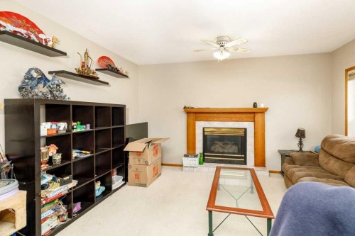 6 Densmore Crescent, Red Deer, AB - Indoor Photo Showing Living Room With Fireplace