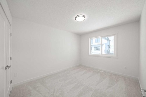 91 Heritage Manor, Cochrane, AB - Indoor Photo Showing Other Room