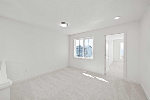 91 Heritage Manor, Cochrane, AB - Indoor Photo Showing Other Room