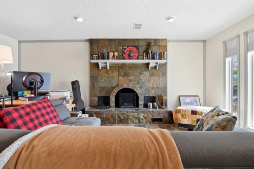 26 Gummow Close, Red Deer, AB - Indoor Photo Showing Living Room With Fireplace