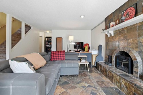 26 Gummow Close, Red Deer, AB - Indoor Photo Showing Living Room With Fireplace