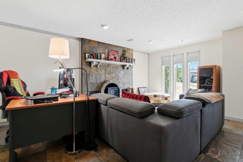 26 Gummow Close, Red Deer, AB - Indoor Photo Showing Living Room With Fireplace