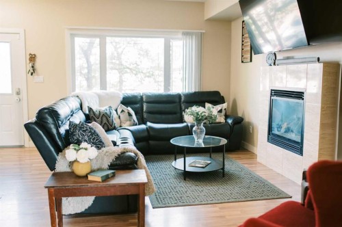 5007B 46 Street, Stettler, AB - Indoor Photo Showing Living Room With Fireplace