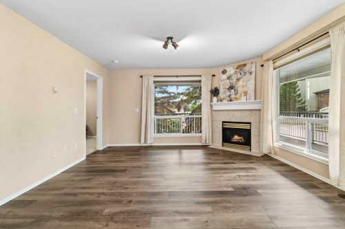 211-6118 53 Avenue, Red Deer, AB - Indoor Photo Showing Living Room With Fireplace