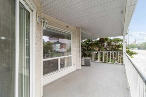 211-6118 53 Avenue, Red Deer, AB - Outdoor With Deck Patio Veranda With Exterior