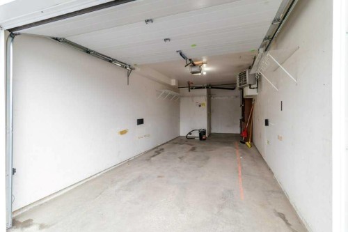 211-6118 53 Avenue, Red Deer, AB - Indoor Photo Showing Garage