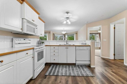 211-6118 53 Avenue, Red Deer, AB - Indoor Photo Showing Kitchen With Double Sink