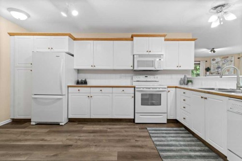 211-6118 53 Avenue, Red Deer, AB - Indoor Photo Showing Kitchen With Double Sink