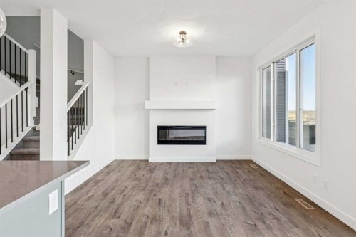 206 Sora Way Se, Calgary, AB - Indoor Photo Showing Living Room With Fireplace