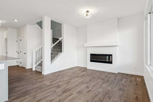 206 Sora Way Se, Calgary, AB - Indoor Photo Showing Living Room With Fireplace