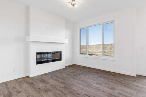 206 Sora Way Se, Calgary, AB - Indoor Photo Showing Living Room With Fireplace