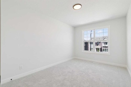 65 Sora Gardens Se, Calgary, AB - Indoor Photo Showing Other Room