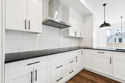 283 Dawson Wharf Rise, Chestermere, AB - Indoor Photo Showing Kitchen With Upgraded Kitchen