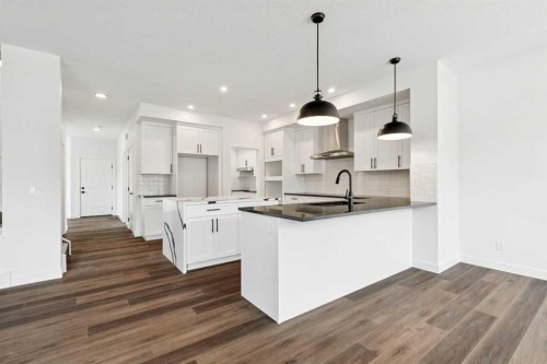 283 Dawson Wharf Rise, Chestermere, AB - Indoor Photo Showing Kitchen With Upgraded Kitchen