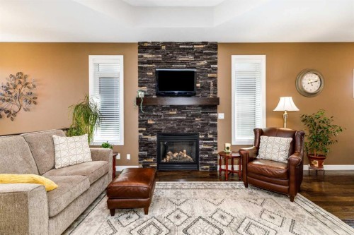 39 Thompson Crescent, Red Deer, AB - Indoor Photo Showing Living Room With Fireplace