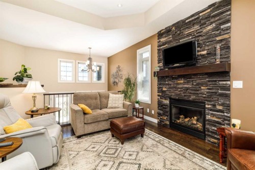 39 Thompson Crescent, Red Deer, AB - Indoor Photo Showing Living Room With Fireplace