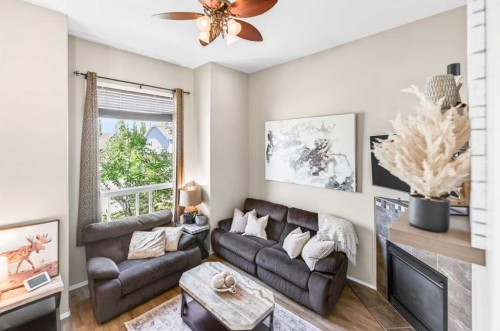 32 Reynolds Road, Sylvan Lake, AB - Indoor Photo Showing Living Room With Fireplace