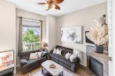 32 Reynolds Road, Sylvan Lake, AB  - Indoor Photo Showing Living Room With Fireplace 