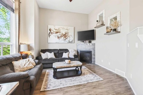 32 Reynolds Road, Sylvan Lake, AB - Indoor Photo Showing Living Room With Fireplace