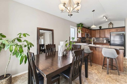 32 Reynolds Road, Sylvan Lake, AB - Indoor Photo Showing Dining Room