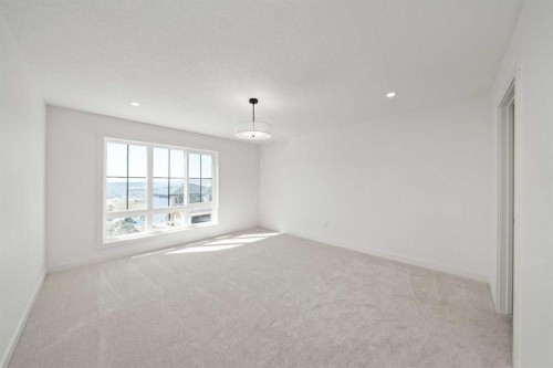 83 Heritage Manor, Cochrane, AB - Indoor Photo Showing Other Room