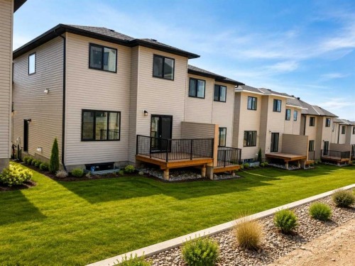83 Heritage Manor, Cochrane, AB - Outdoor With Exterior