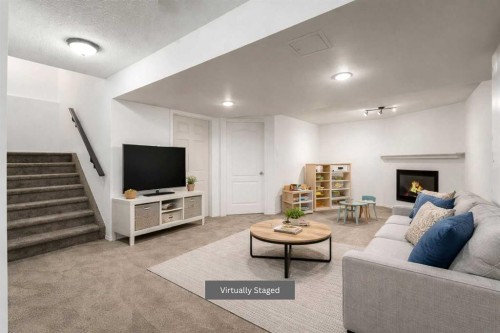 1406 High Country Drive Nw, High River, AB - Indoor Photo Showing Living Room With Fireplace