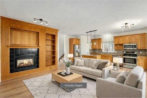 1406 High Country Drive Nw, High River, AB - Indoor Photo Showing Living Room With Fireplace