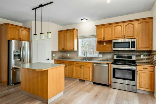 1406 High Country Drive Nw, High River, AB - Indoor Photo Showing Kitchen With Double Sink