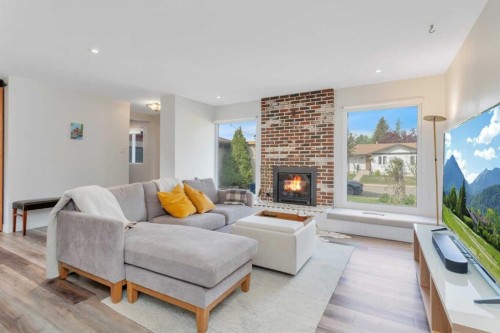 31 Macfarlane Avenue, Red Deer, AB - Indoor Photo Showing Living Room With Fireplace