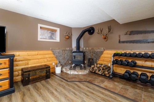 1805 27 Avenue, Delburne, AB - Indoor Photo Showing Other Room With Fireplace