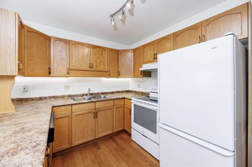 59-2816 Botterill Crescent, Red Deer, AB - Indoor Photo Showing Kitchen With Double Sink