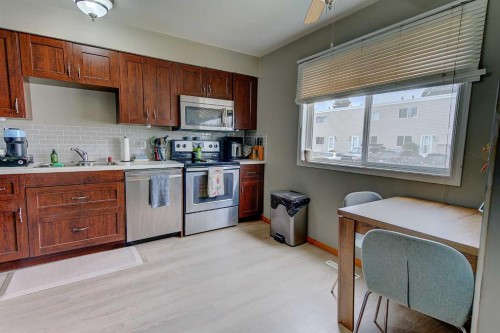 504-4719 33 Street, Red Deer, AB - Indoor Photo Showing Kitchen With Double Sink