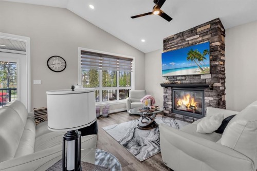5052 Lakeshore Drive, Sylvan Lake, AB - Indoor Photo Showing Living Room With Fireplace
