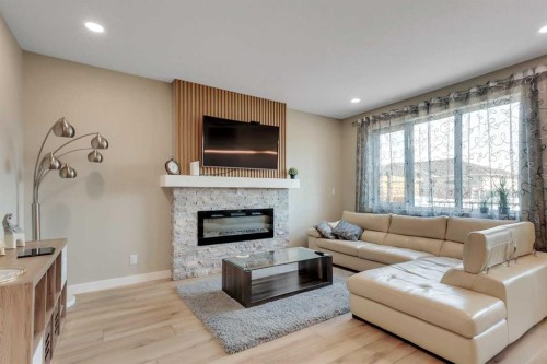 18 Athens Place, Blackfalds, AB - Indoor Photo Showing Living Room With Fireplace