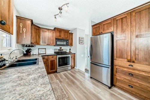 8 Haliburton Crescent, Red Deer, AB - Indoor Photo Showing Kitchen With Stainless Steel Kitchen With Double Sink