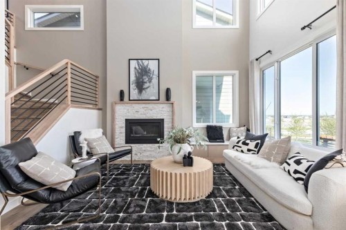 210 Sora Way Se, Calgary, AB - Indoor Photo Showing Living Room With Fireplace