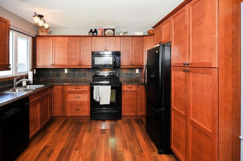 4414 67 Street, Camrose, AB - Indoor Photo Showing Kitchen With Double Sink