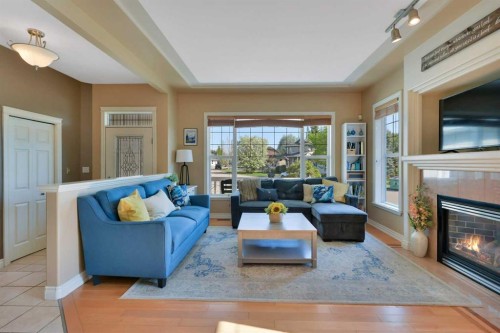 1 Spruce Close, Lacombe, AB - Indoor Photo Showing Living Room With Fireplace