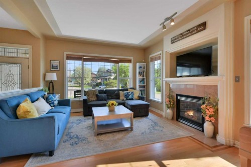 1 Spruce Close, Lacombe, AB - Indoor Photo Showing Living Room With Fireplace