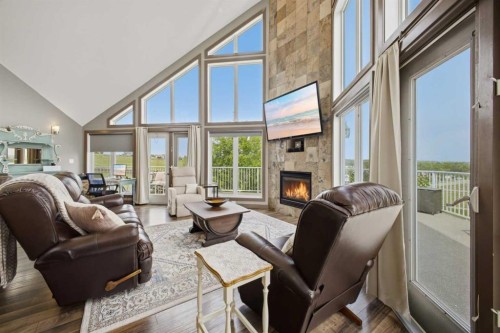 1 Aspen Rise, Parkland Beach, AB - Indoor Photo Showing Living Room With Fireplace