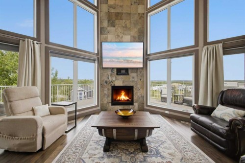 1 Aspen Rise, Parkland Beach, AB - Indoor Photo Showing Living Room With Fireplace