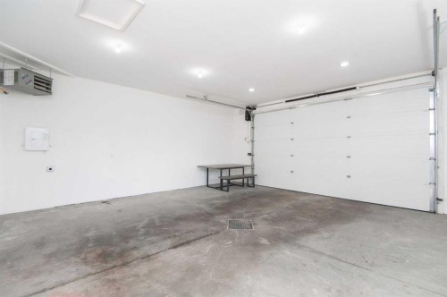 104 Almond Crescent, Blackfalds, AB - Indoor Photo Showing Garage