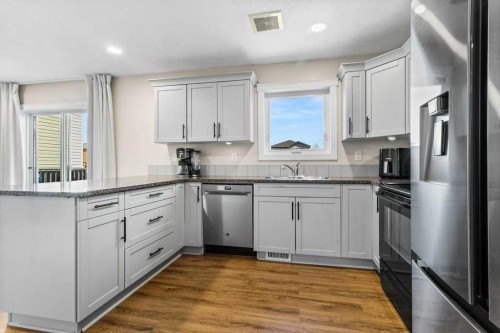 87 Almond Crescent, Blackfalds, AB - Indoor Photo Showing Kitchen With Double Sink